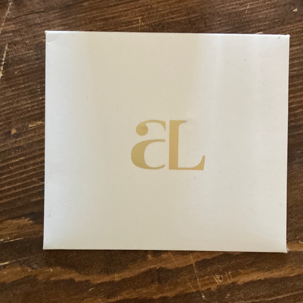 Abbott Lyon gold “S” charm
